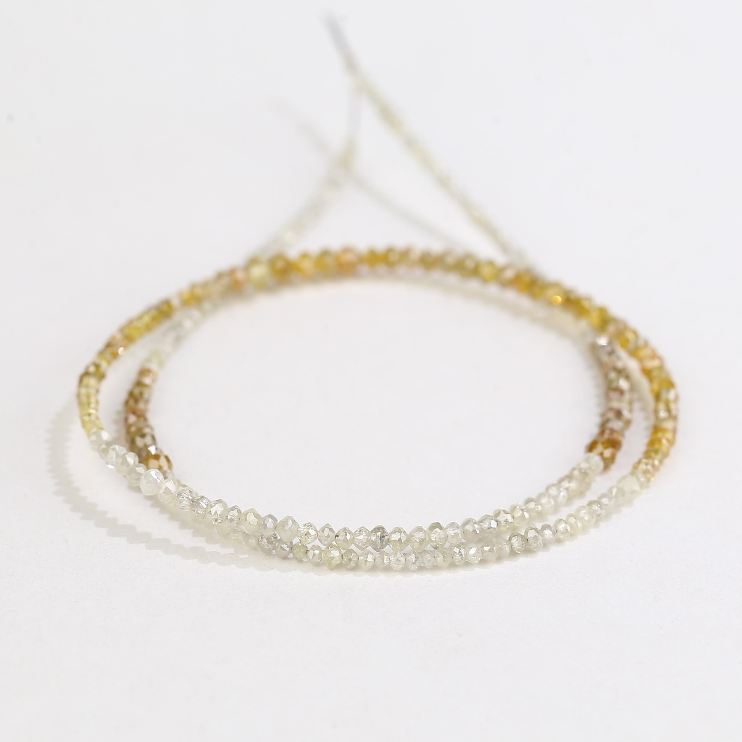 Multistrand beaded necklace on a white background