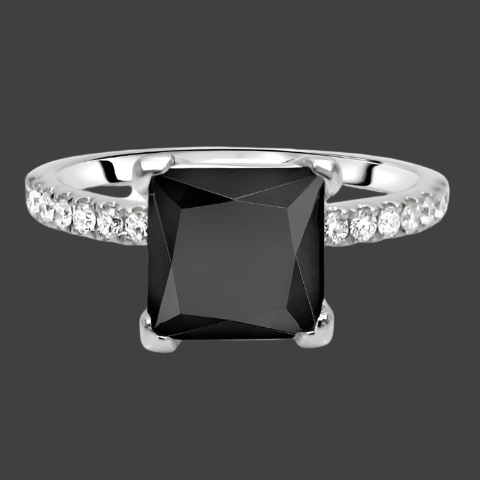 A black princess cut diamond engagement ring with pave set round diamonds on a 14k white gold band.