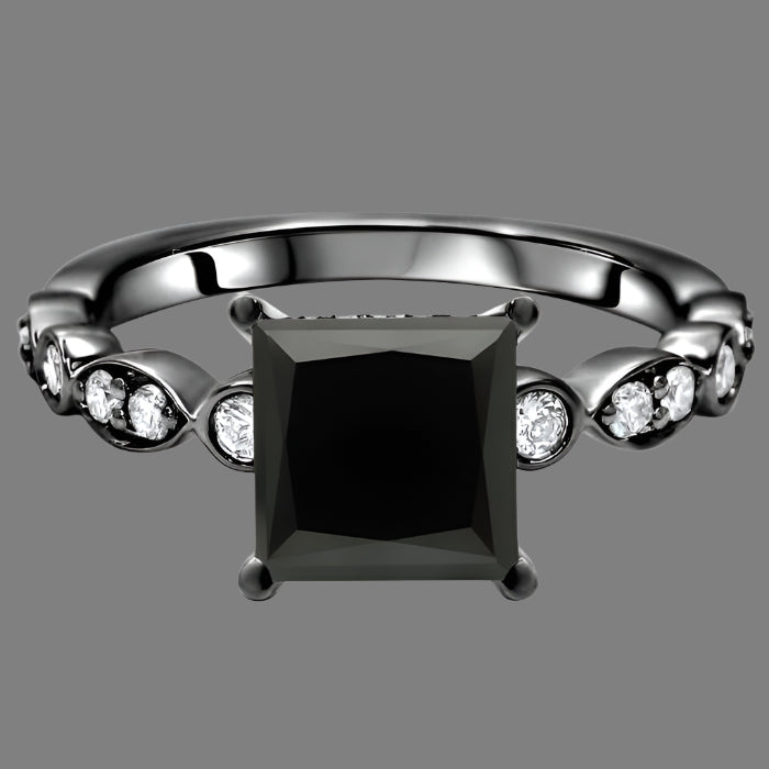 A black princess cut diamond engagement ring with hidden halo and accent diamonds set in a band made of 14K black gold.