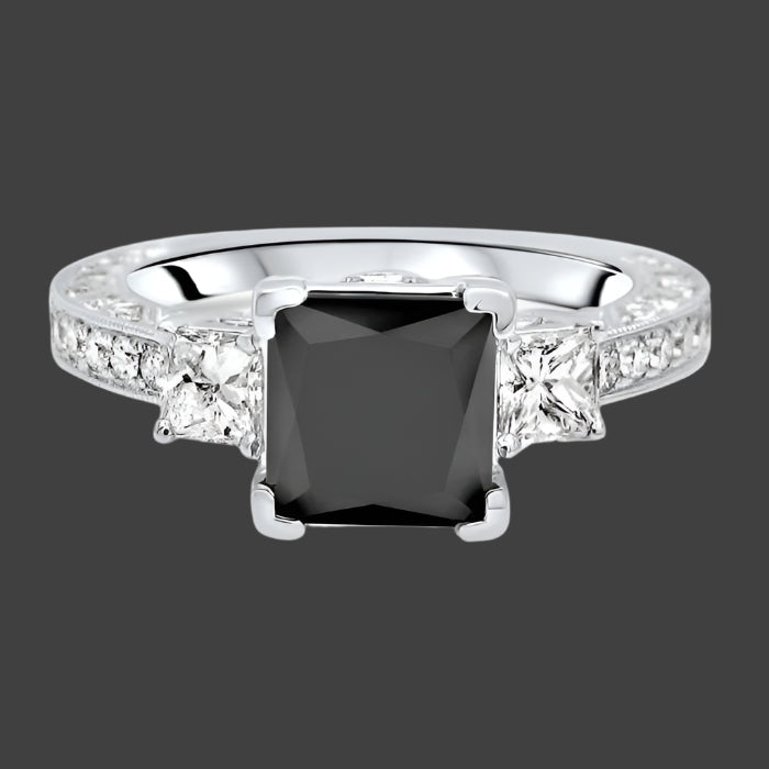 A black princess cut diamond engagement ring with two smaller princess cut diamonds on the sides, set in a 14K white gold band with pave, prong, and bezel set diamonds.