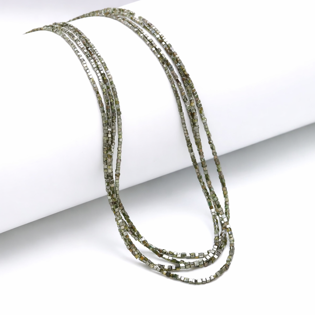 Multistrand beaded necklace on a white background