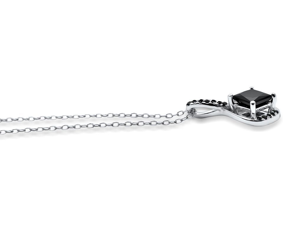 Silver necklace with a black gemstone pendant on a white background