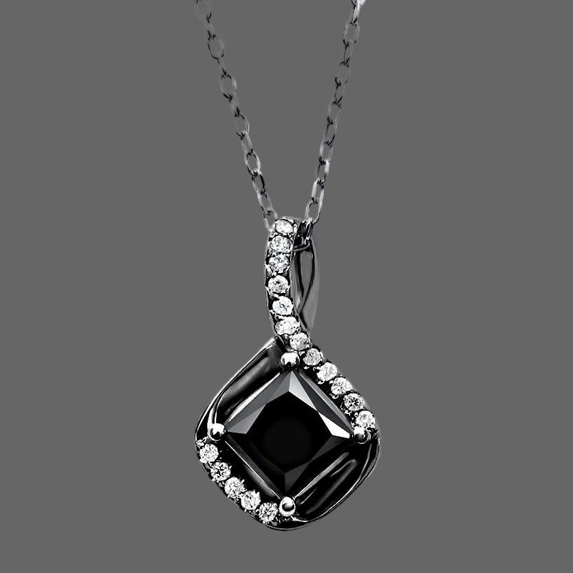 Black gemstone pendant with chain on a white background