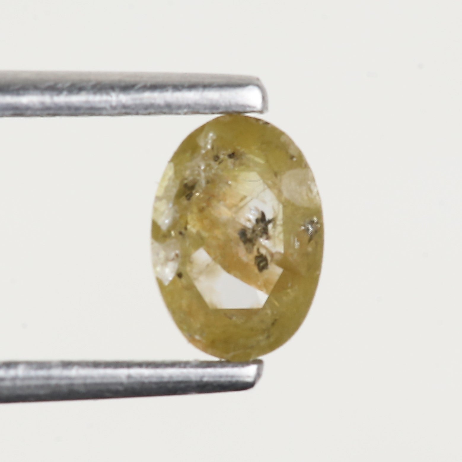 0.43 Ct Oval Salt and Pepper Yellow Natural Diamond 5.6 MM