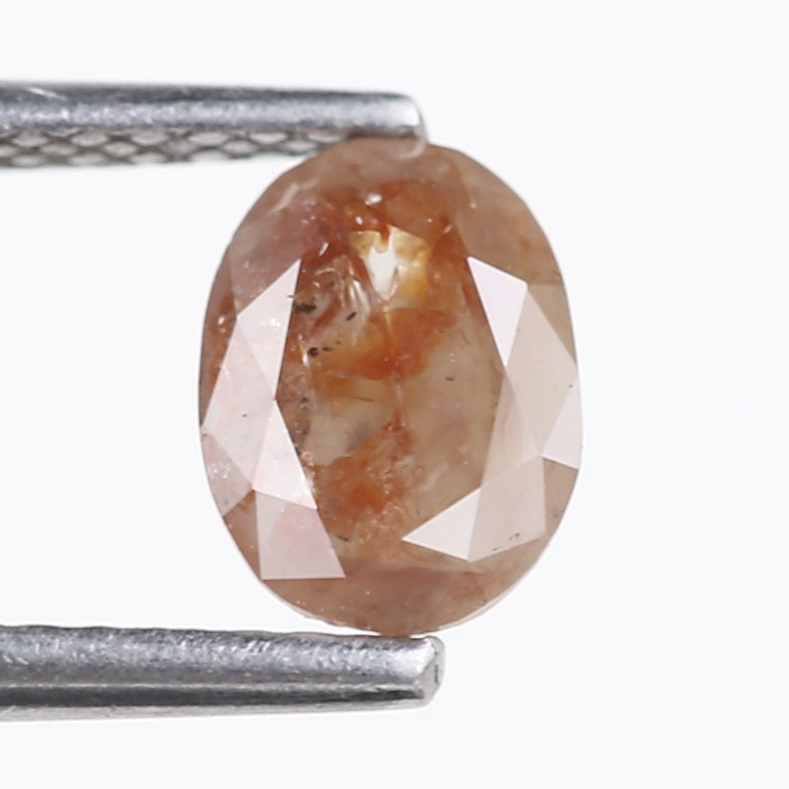 0.76 Carat Natural Orange Oval Cut Salt and Pepper Diamond 7.13 MM