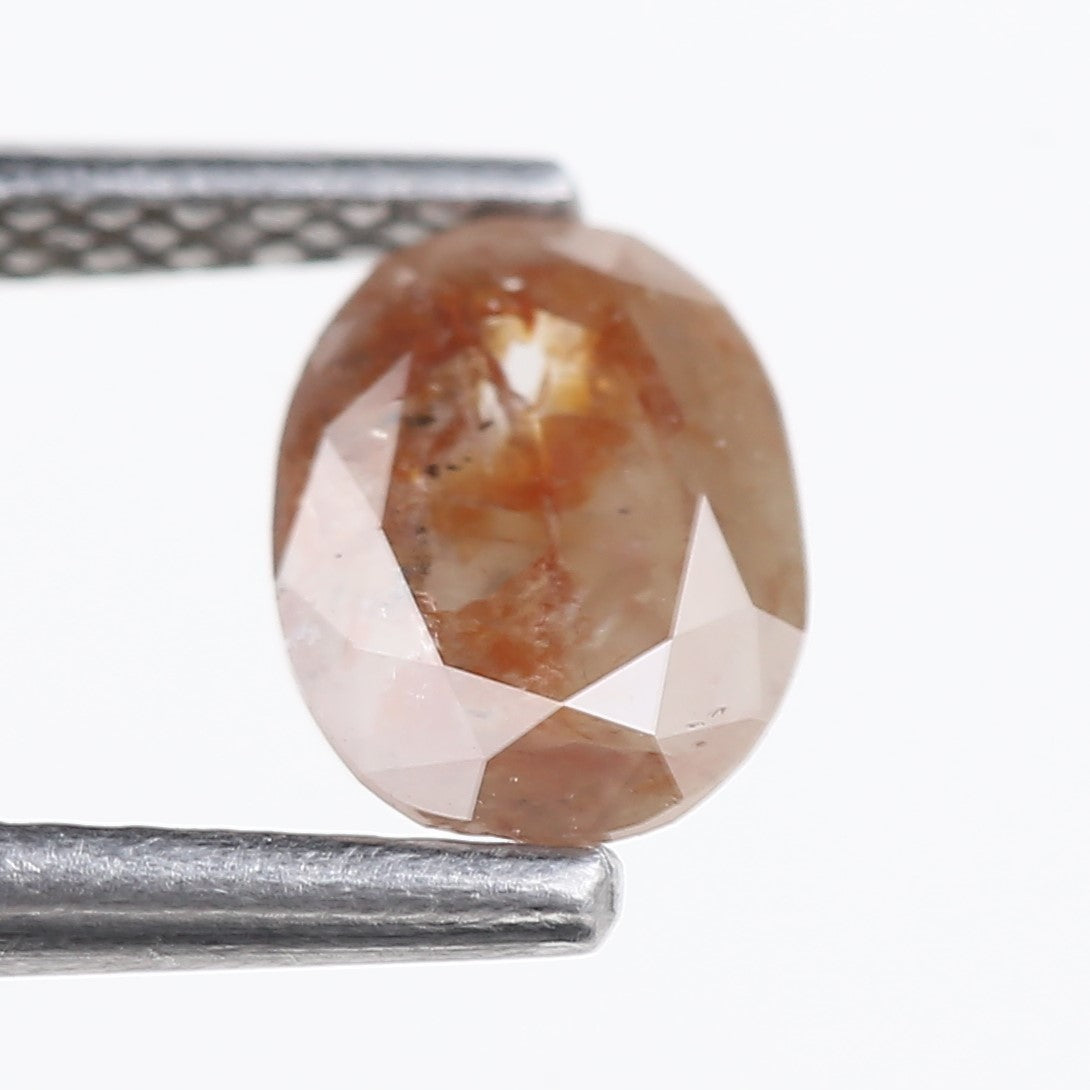 0.76 Carat Natural Orange Oval Cut Salt and Pepper Diamond 7.13 MM