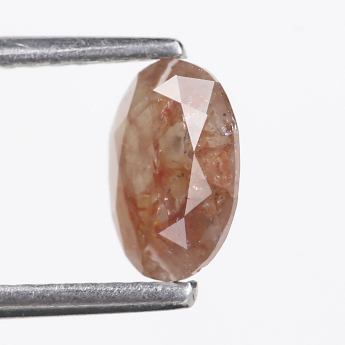 0.76 Carat Natural Orange Oval Cut Salt and Pepper Diamond 7.13 MM