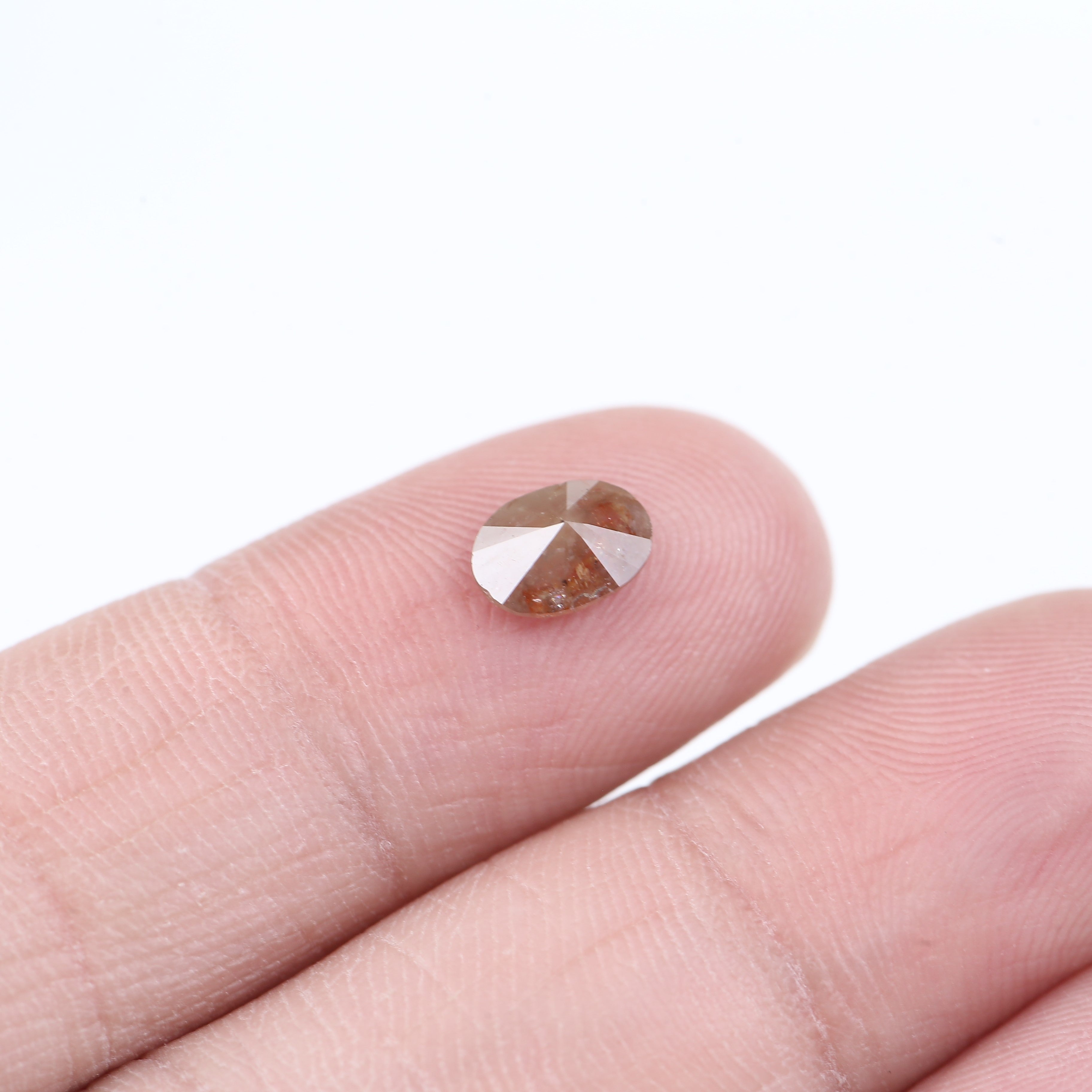 0.76 Carat Natural Orange Oval Cut Salt and Pepper Diamond 7.13 MM