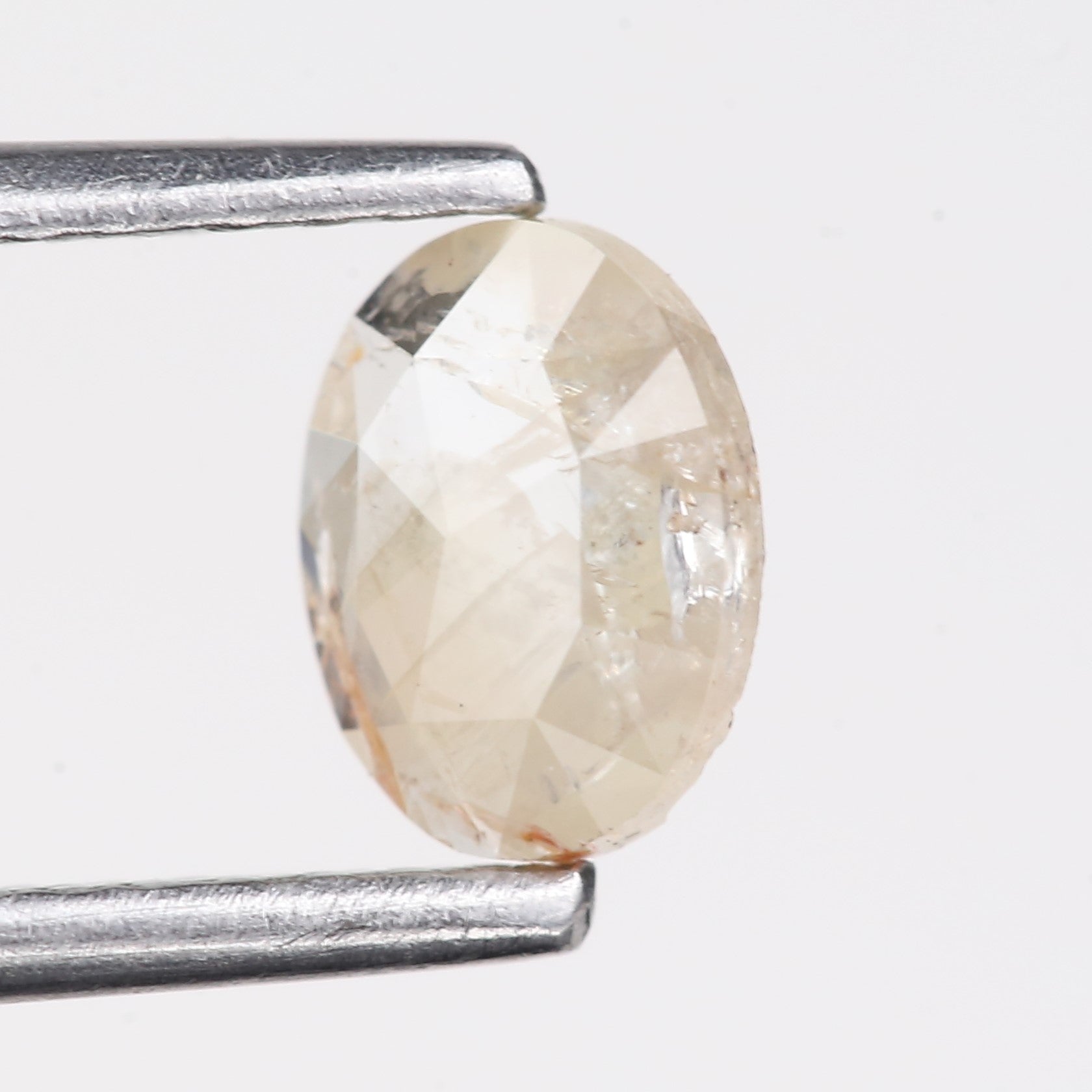 0.48 Carat Natural Light Orange Oval Cut Salt And Pepper Diamond 6.09 MM