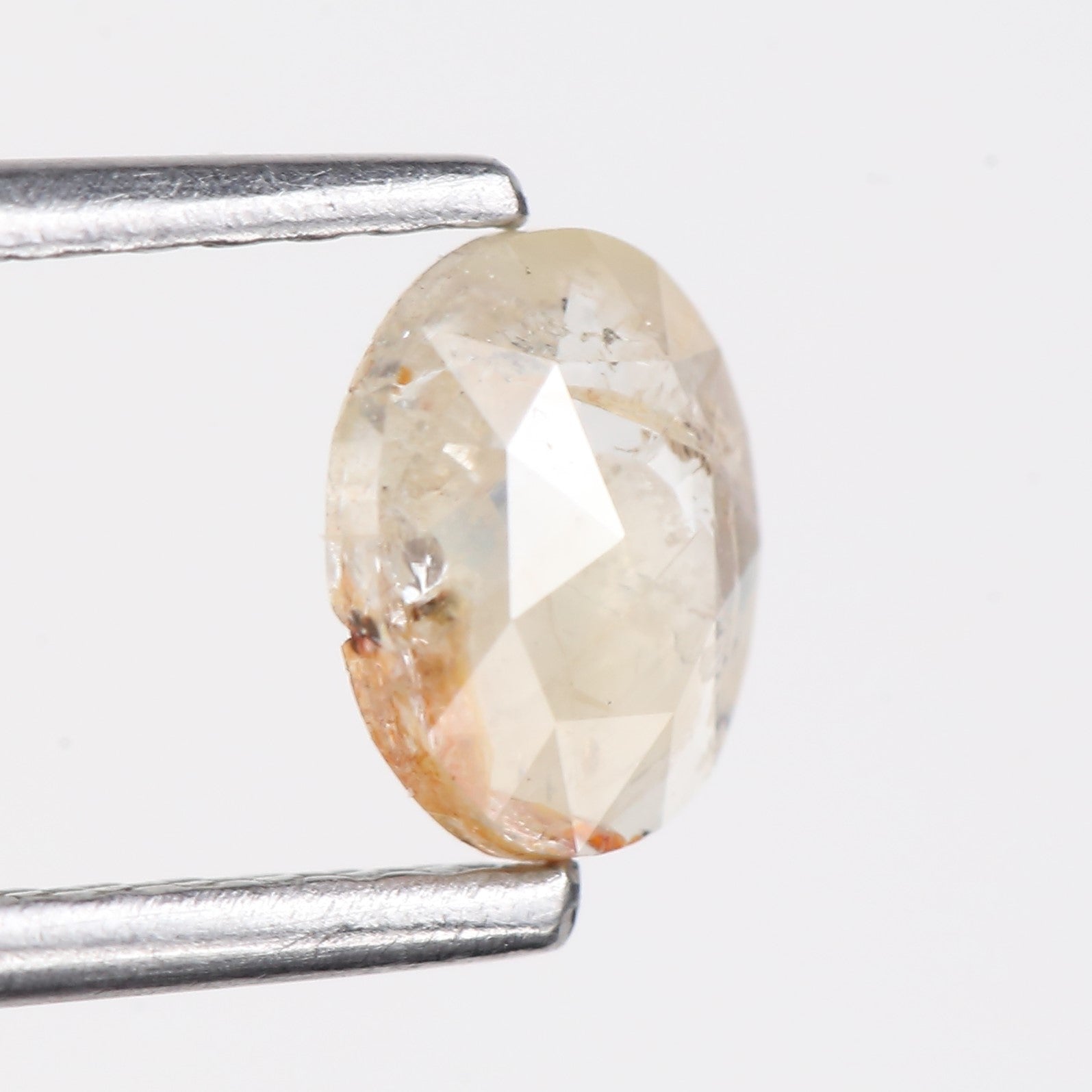 0.48 Carat Natural Light Orange Oval Cut Salt And Pepper Diamond 6.09 MM