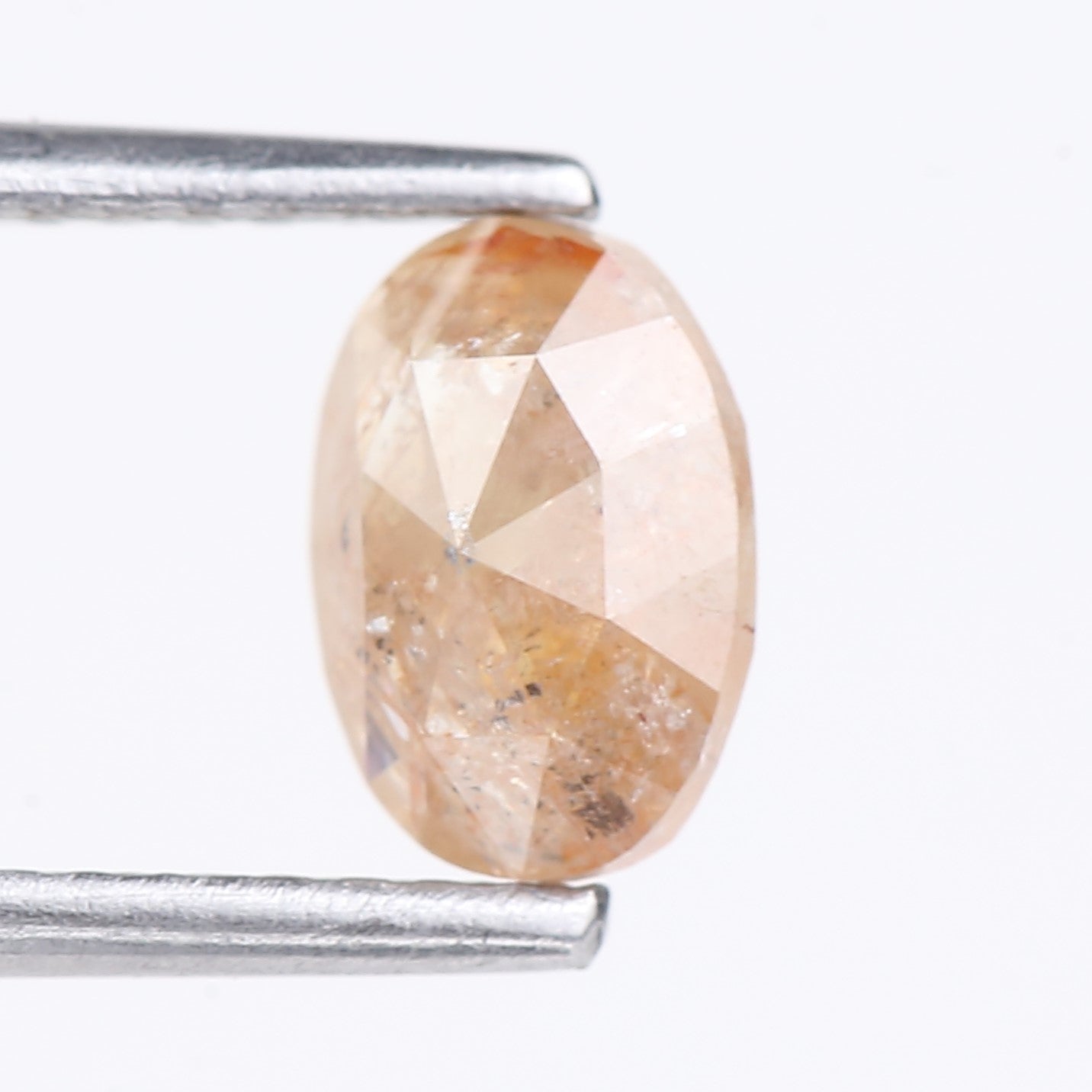 0.91 Carat Natural Light Orange Oval Cut Salt And Pepper Diamond 6.92 MM