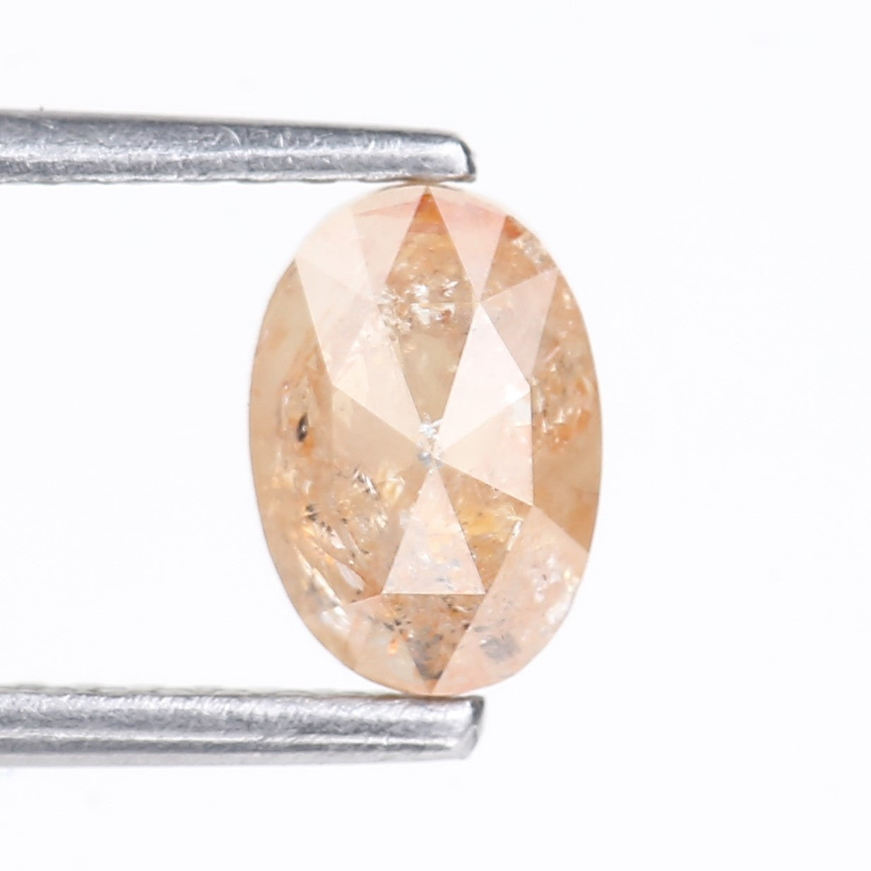 0.91 Carat Natural Light Orange Oval Cut Salt And Pepper Diamond 6.92 MM