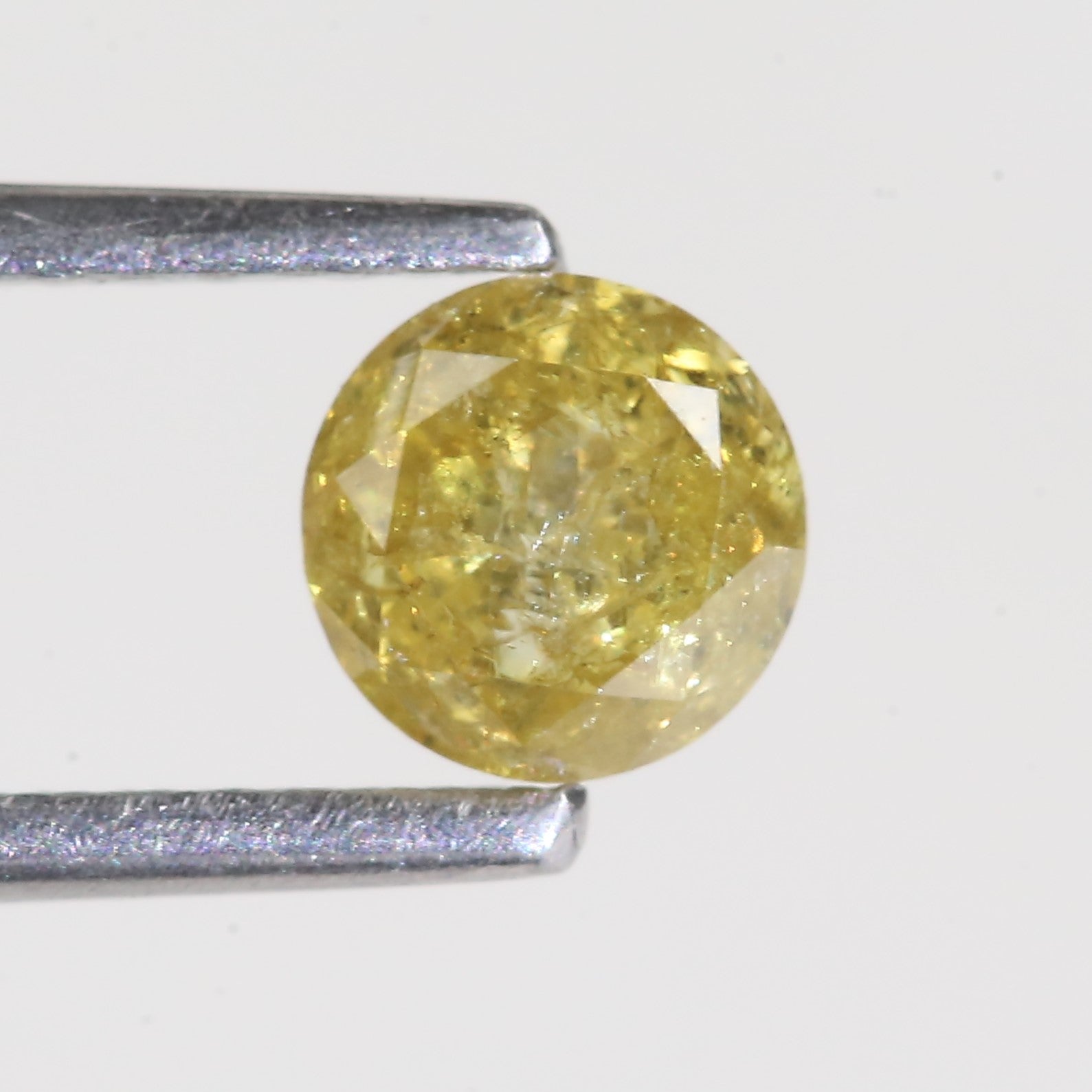 0.59 Carat Natural Salt And Pepper Round Cut Yellow Diamond 4.97 MM