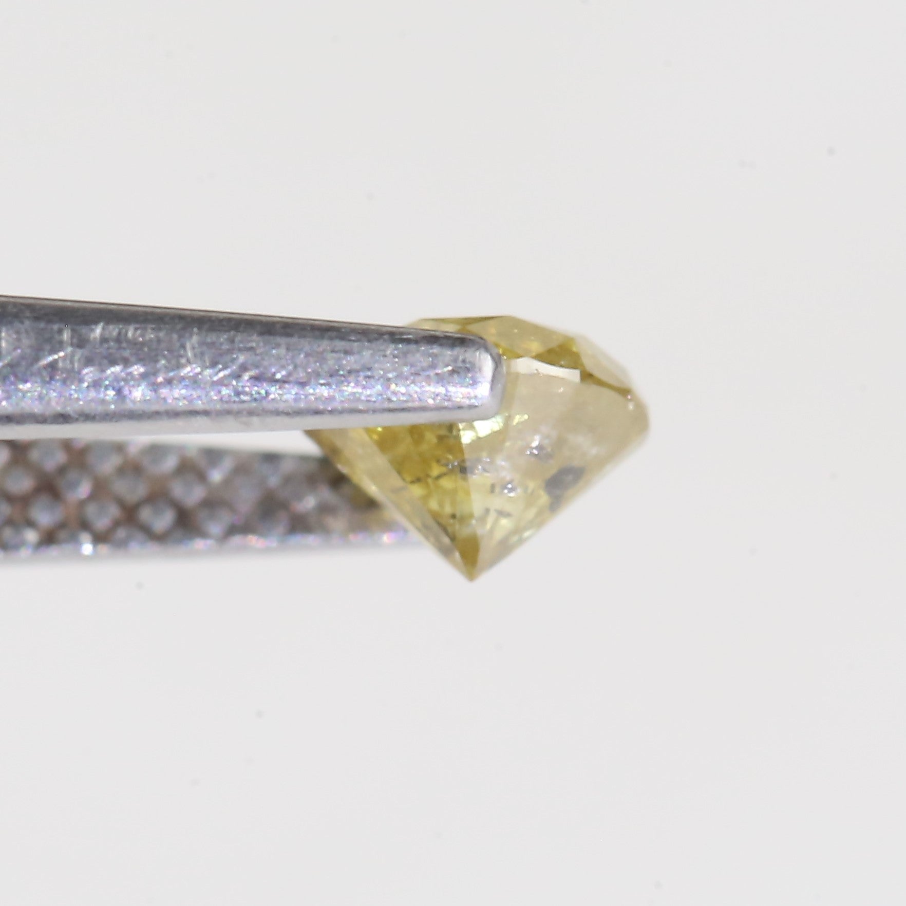 0.59 Carat Natural Salt And Pepper Round Cut Yellow Diamond 4.97 MM