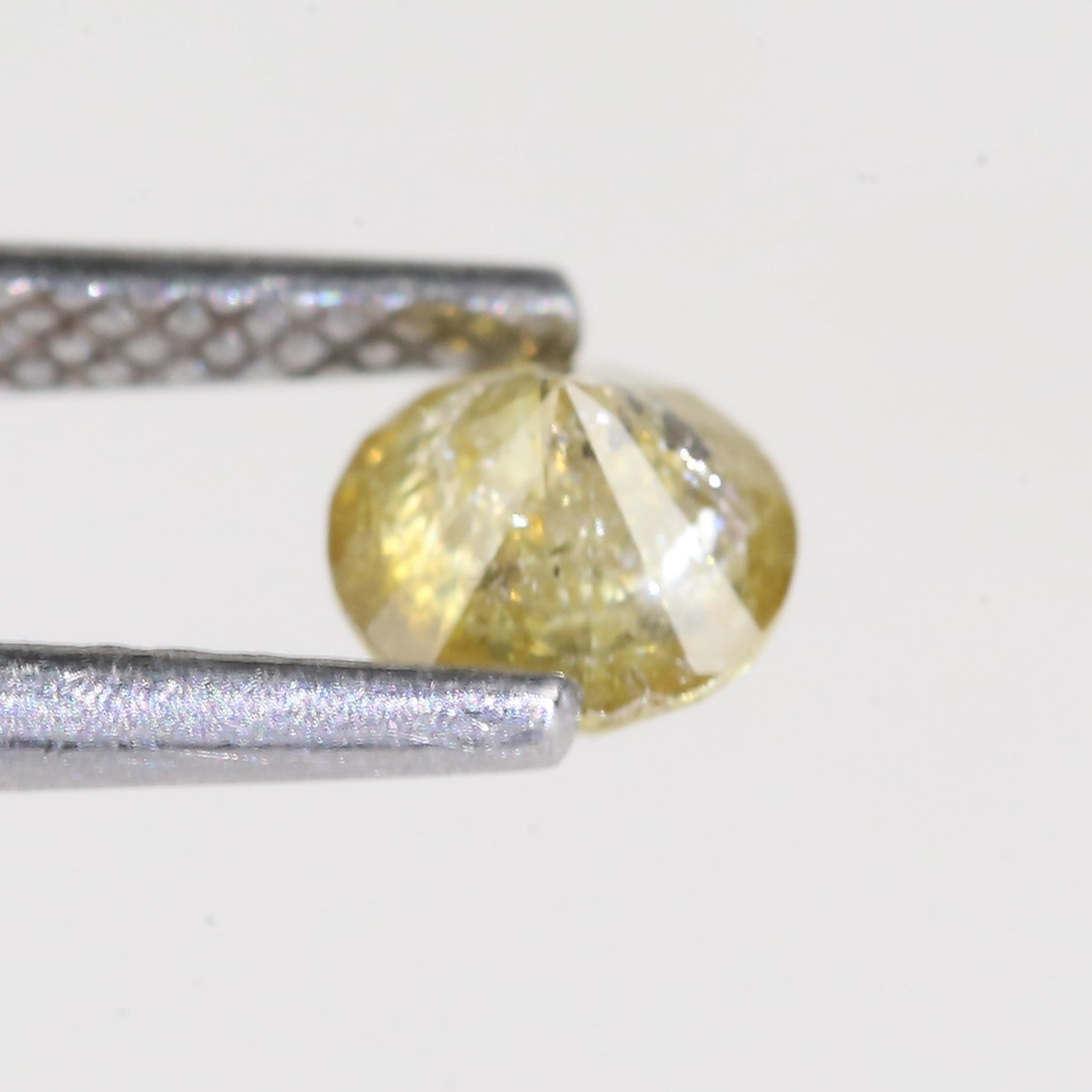 0.59 Carat Natural Salt And Pepper Round Cut Yellow Diamond 4.97 MM