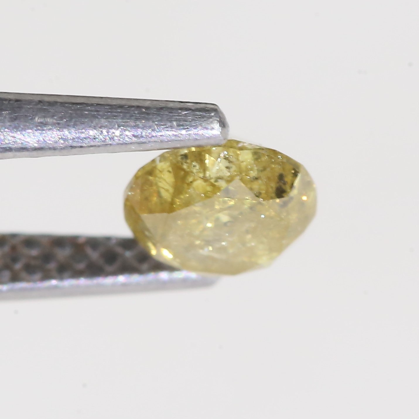 0.59 Carat Natural Salt And Pepper Round Cut Yellow Diamond 4.97 MM