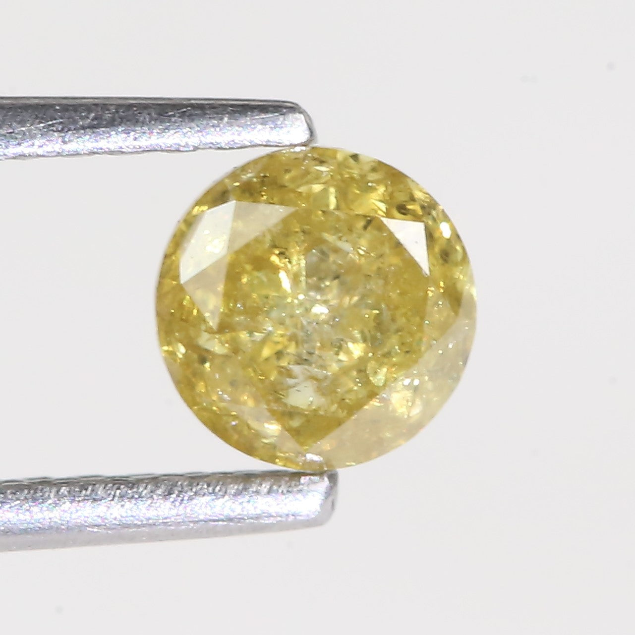0.59 Carat Natural Salt And Pepper Round Cut Yellow Diamond 4.97 MM