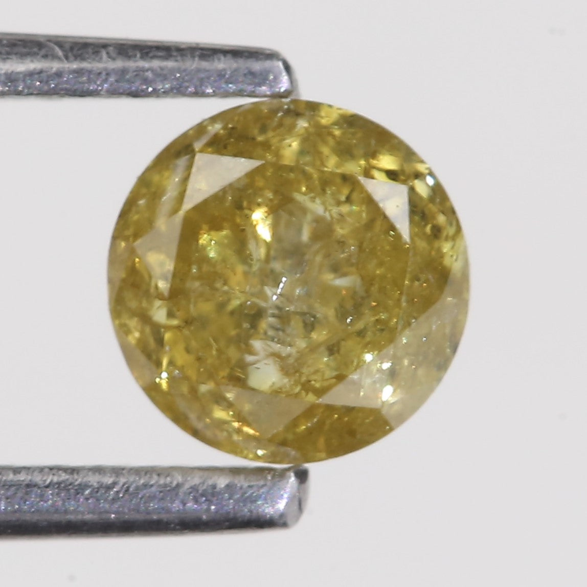 0.59 Carat Natural Salt And Pepper Round Cut Yellow Diamond 4.97 MM