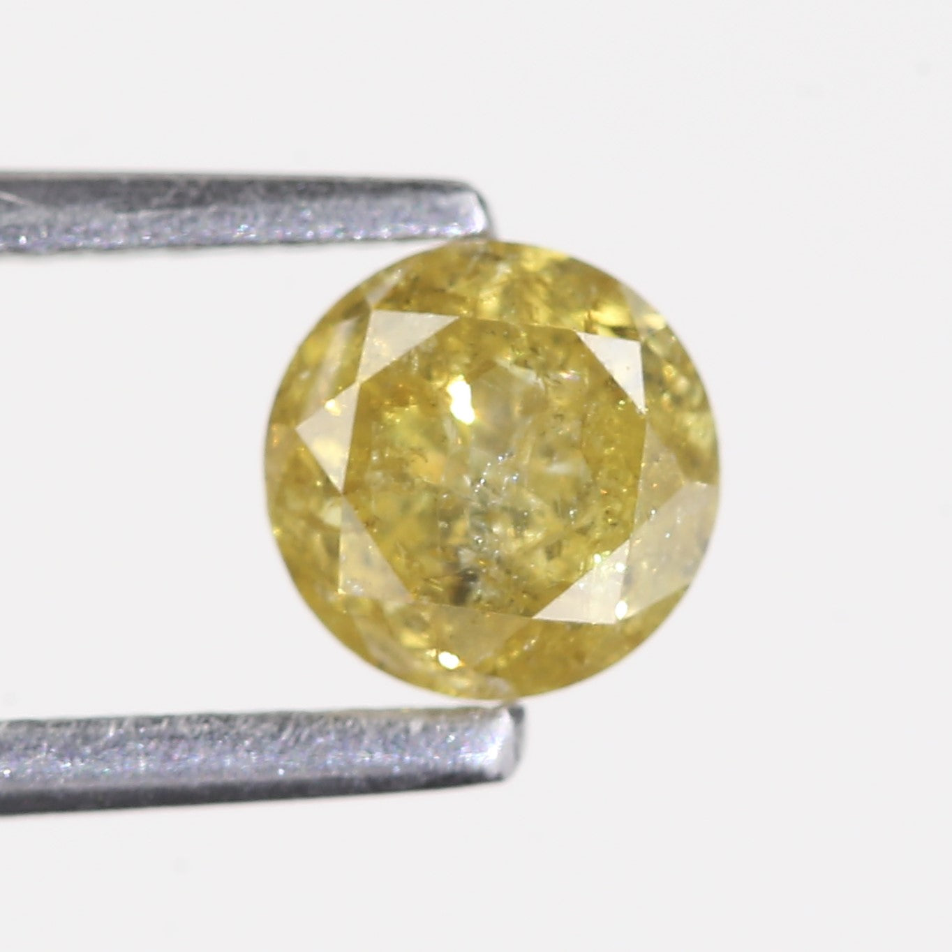 0.59 Carat Natural Salt And Pepper Round Cut Yellow Diamond 4.97 MM
