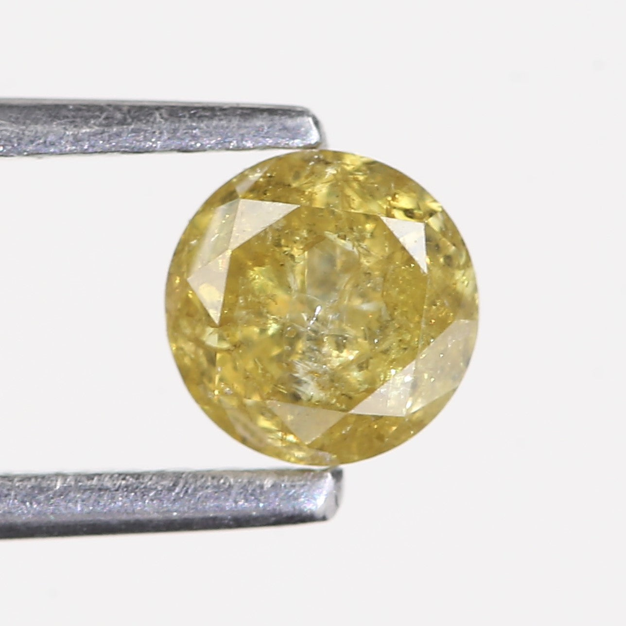 0.59 Carat Natural Salt And Pepper Round Cut Yellow Diamond 4.97 MM