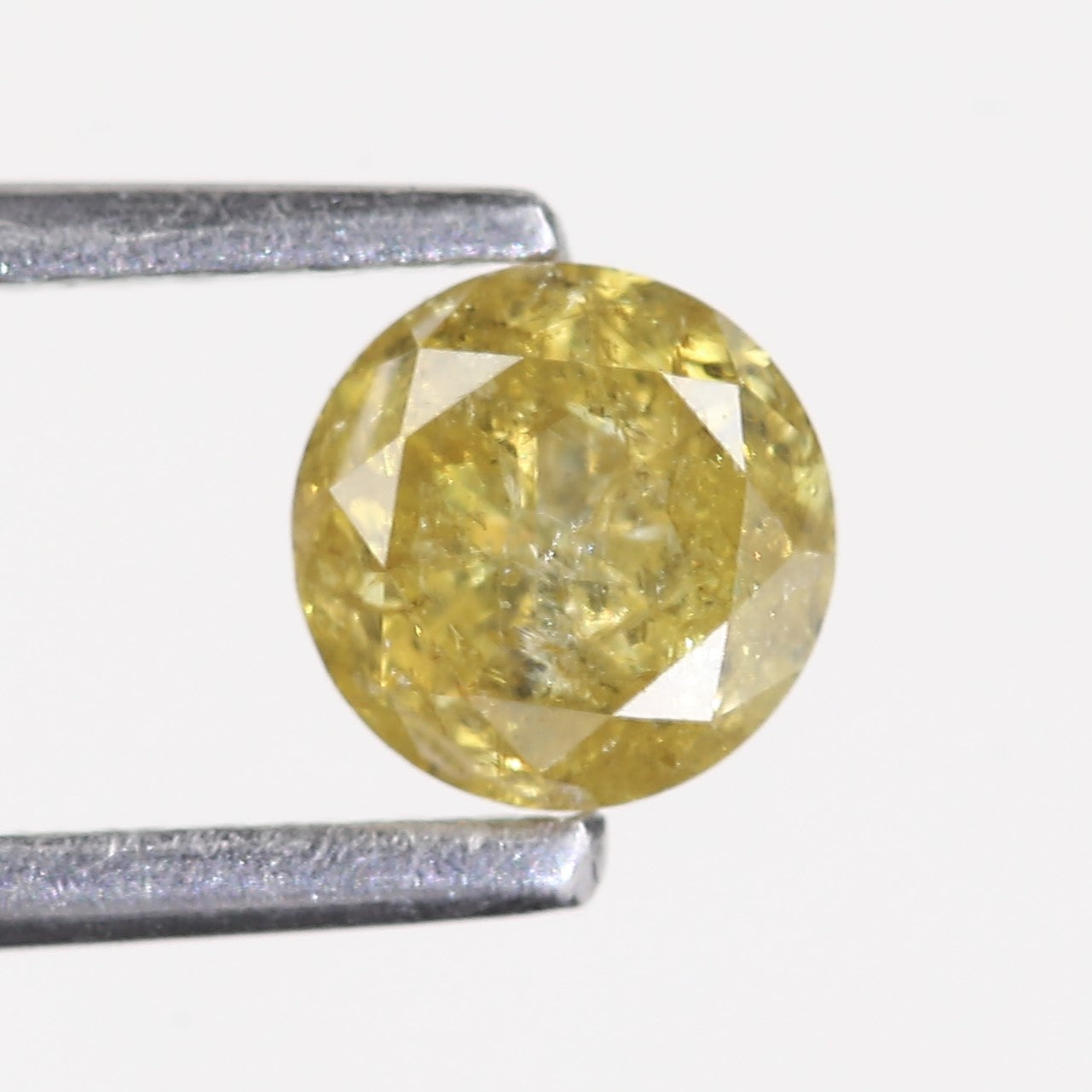 0.59 Carat Natural Salt And Pepper Round Cut Yellow Diamond 4.97 MM
