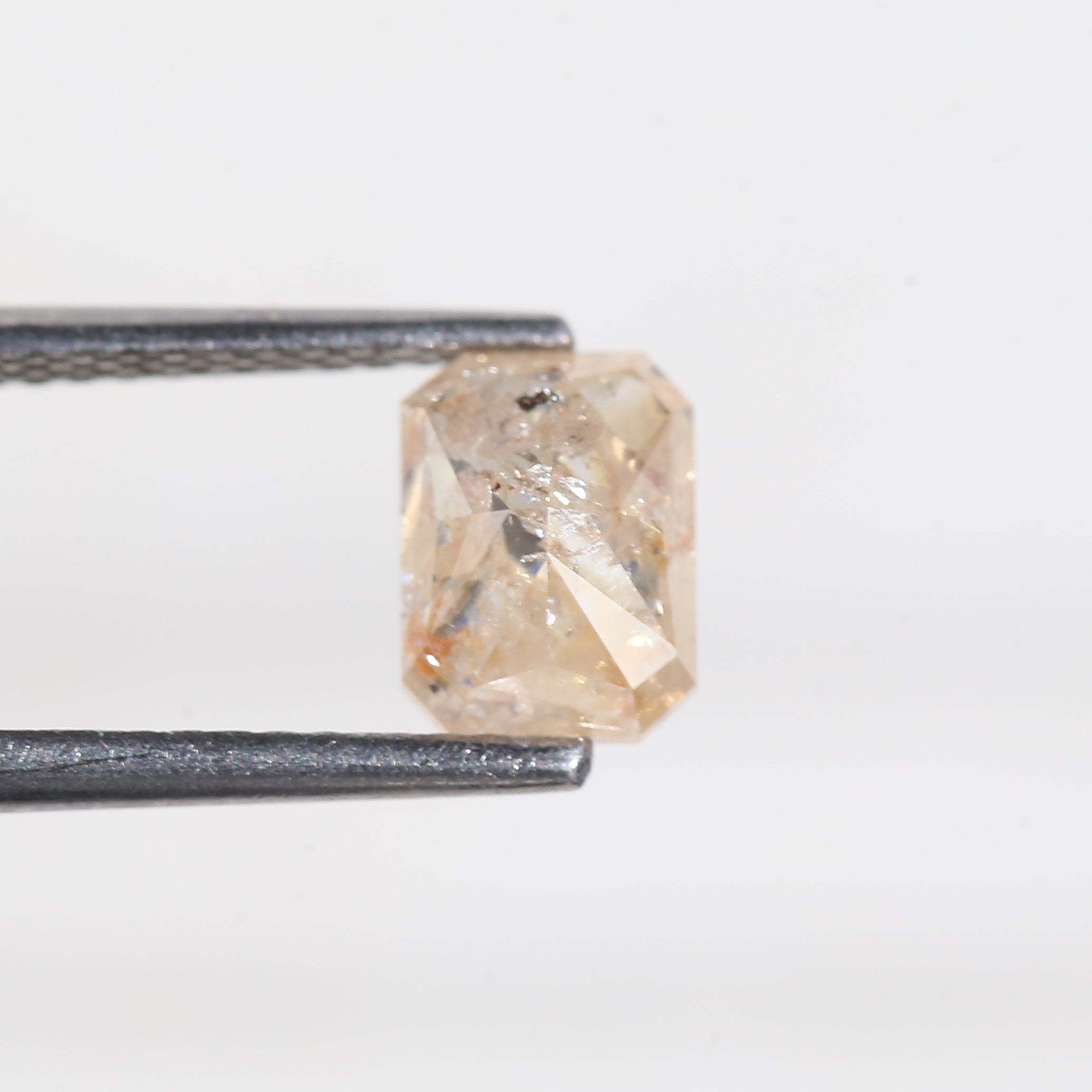 1.4 Carat Orange Emerald Cut Salt and Pepper Diamond 7 MM