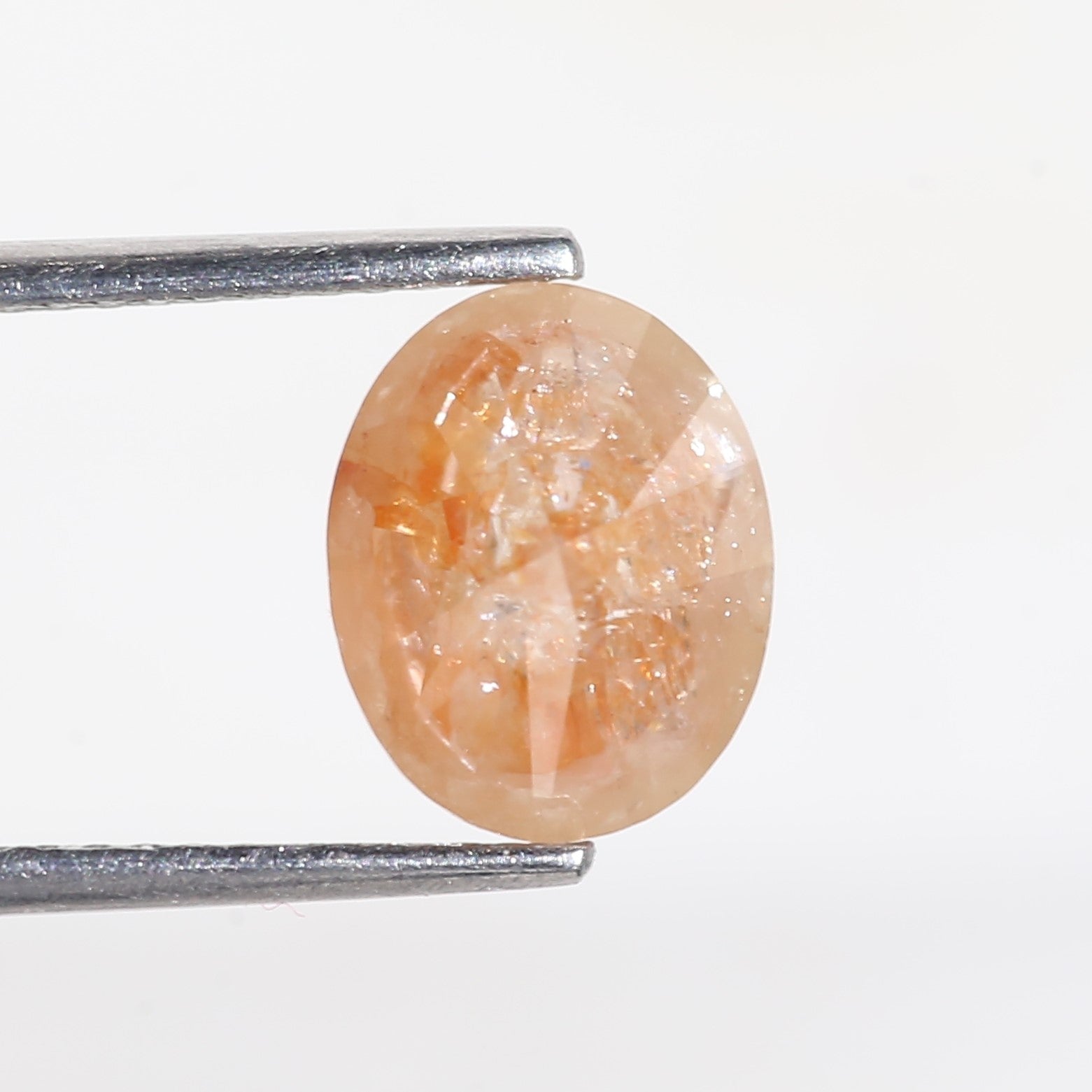 2.57 Carat Oval Cut Orange Salt and Pepper Diamond 7.4 MM