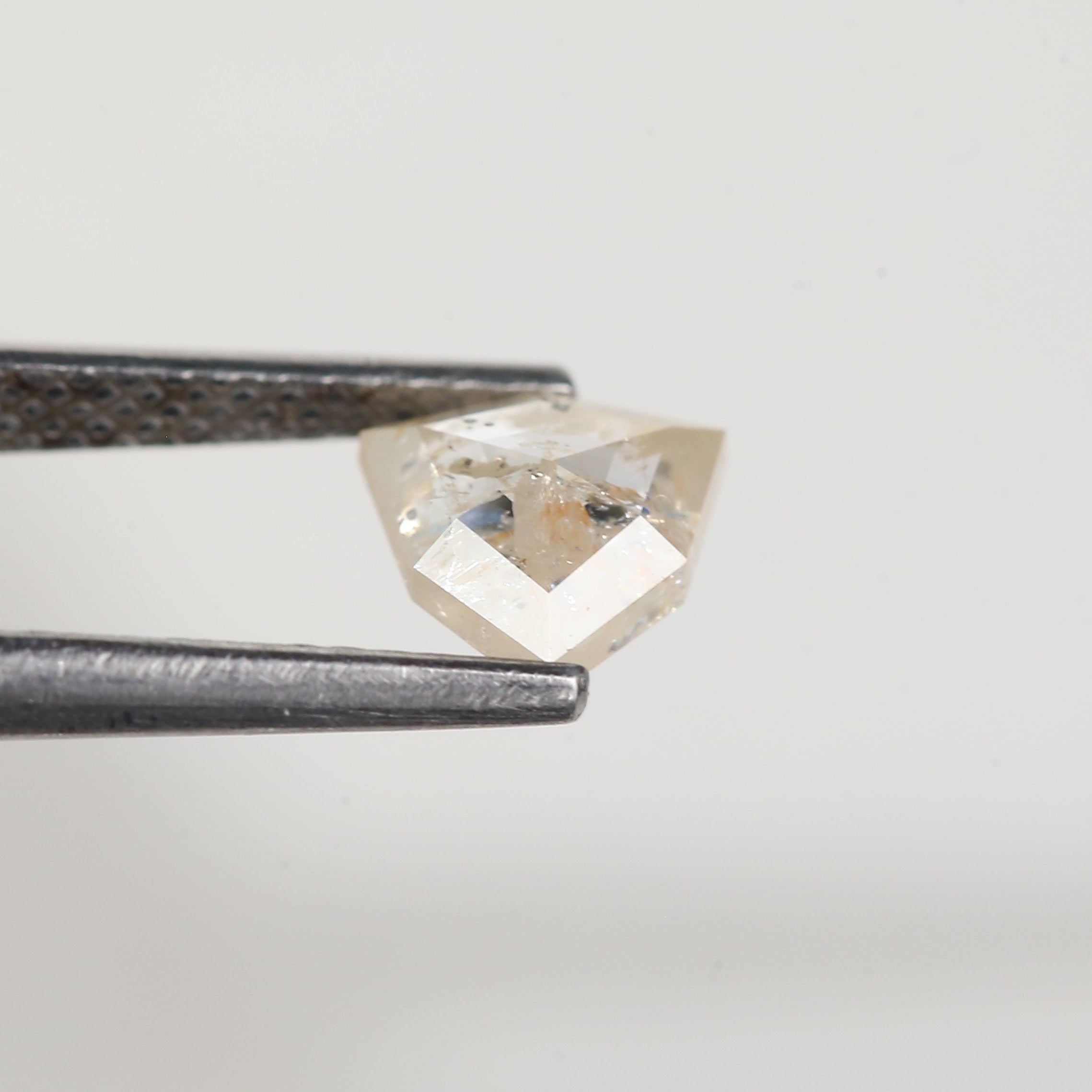 0.72 Carat Natural Shield Cut Orange Salt and Pepper Diamond 6.3 MM
