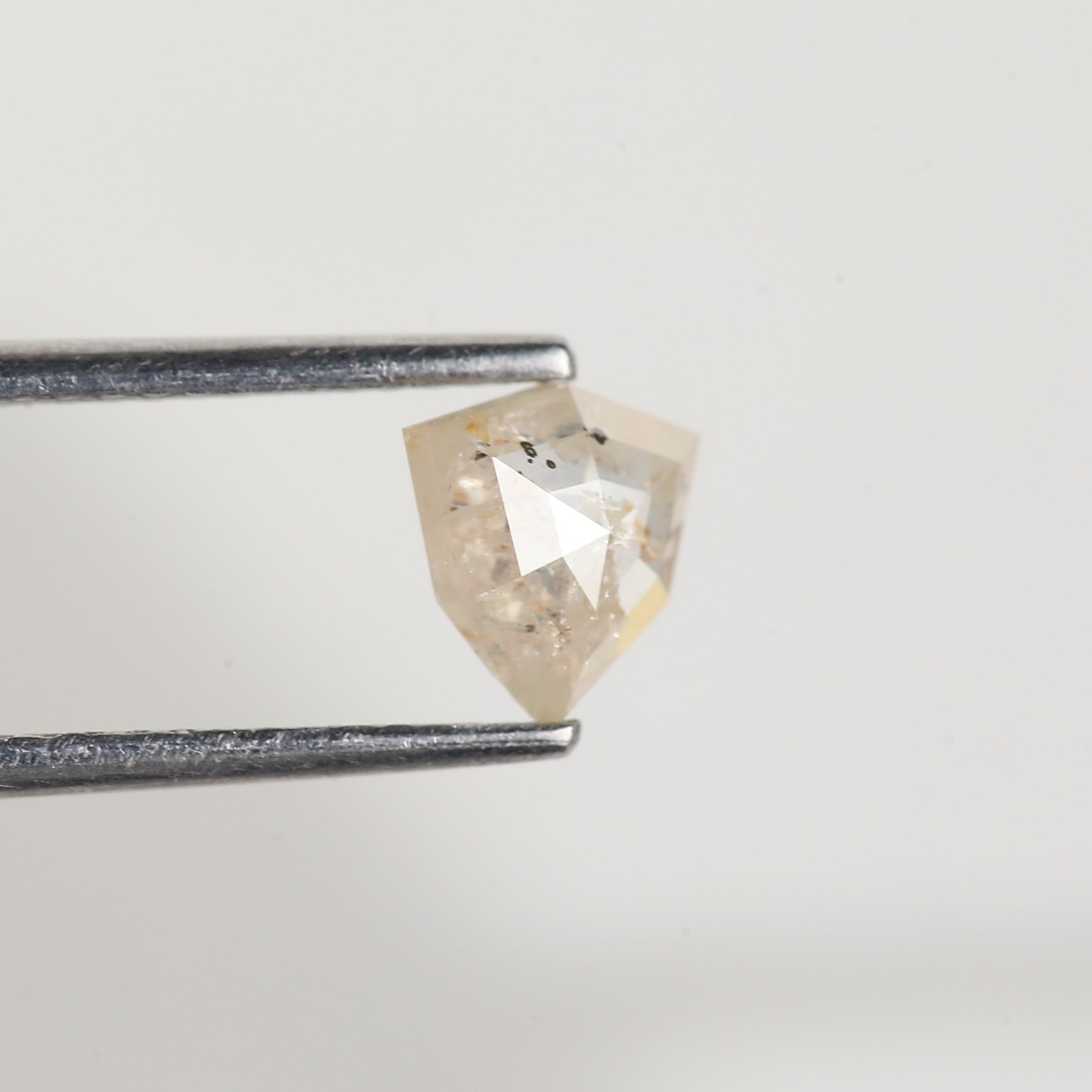 0.72 Carat Natural Shield Cut Orange Salt and Pepper Diamond 6.3 MM