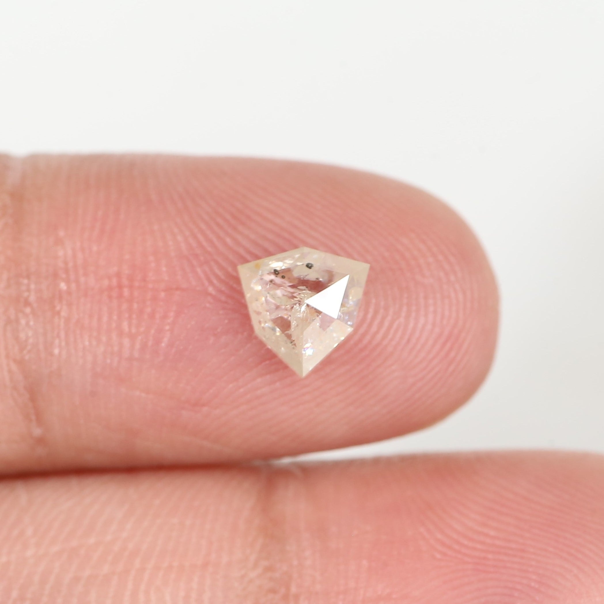 0.72 Carat Natural Shield Cut Orange Salt and Pepper Diamond 6.3 MM