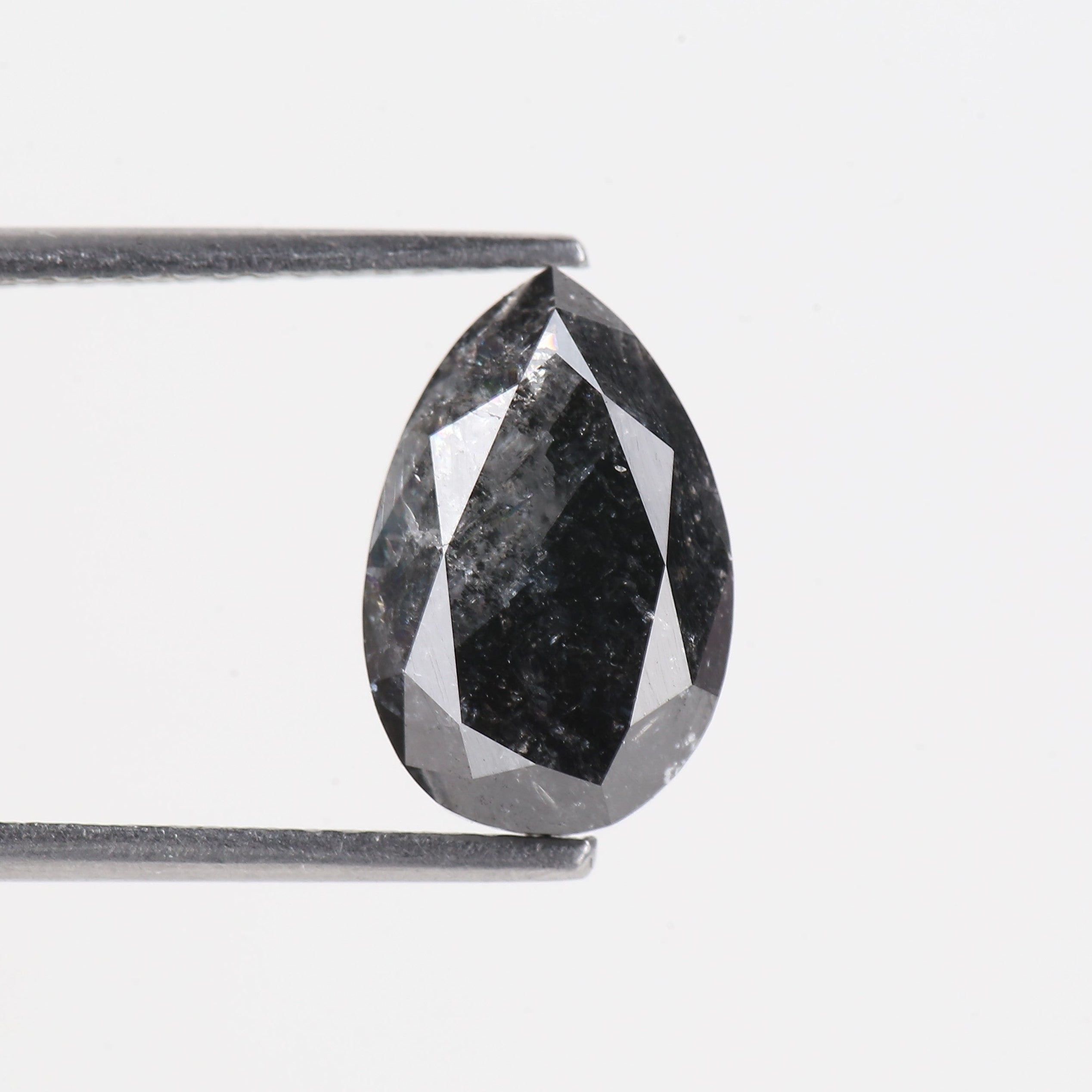 Faceted black stone on a white background
