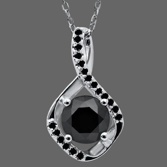 Silver pendant with a black gemstone on a white background