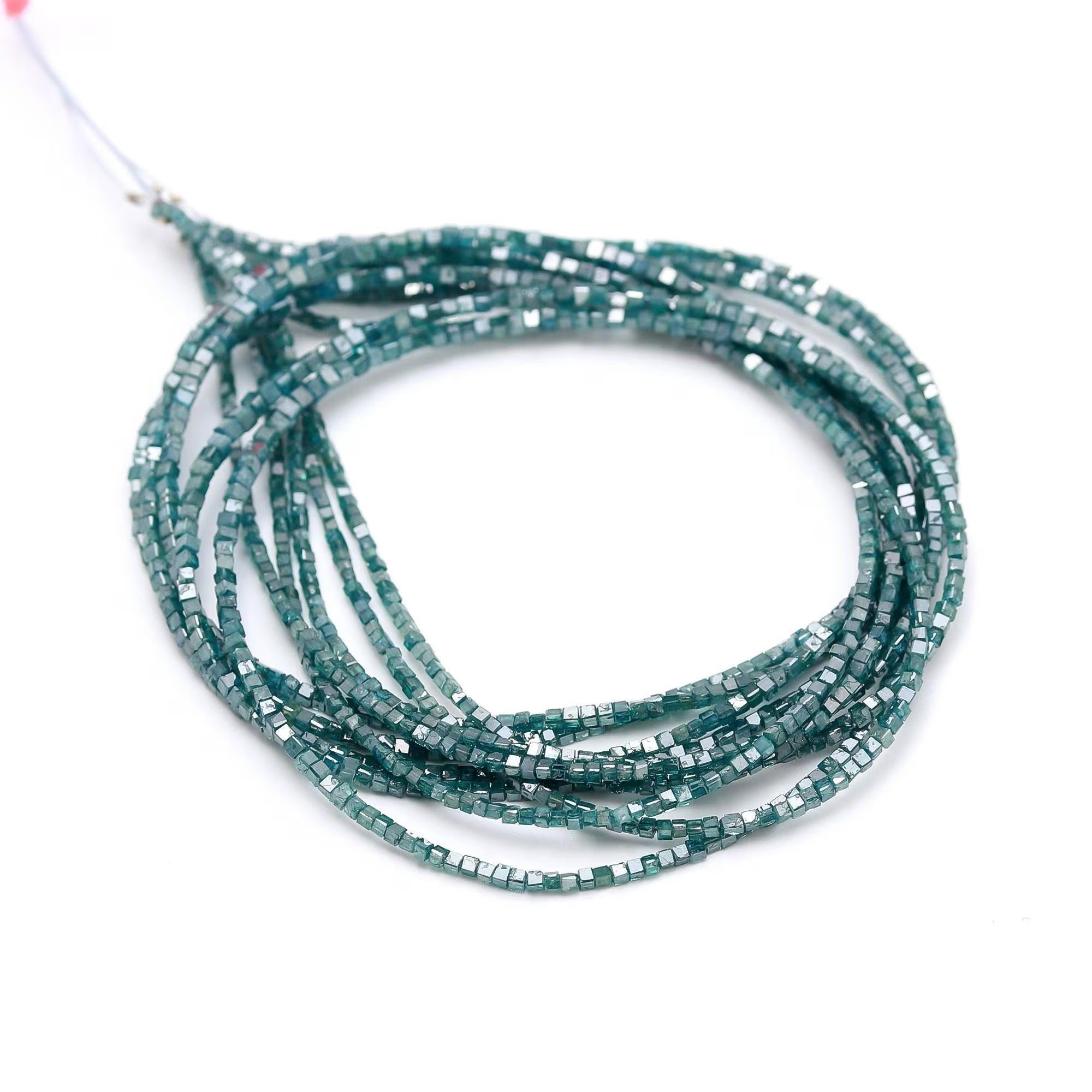 Teal beaded string on a white background