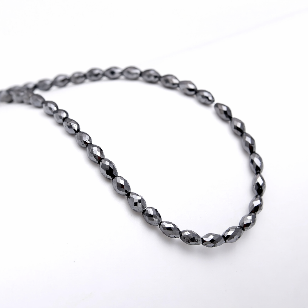 Hematite beaded necklace on a white background