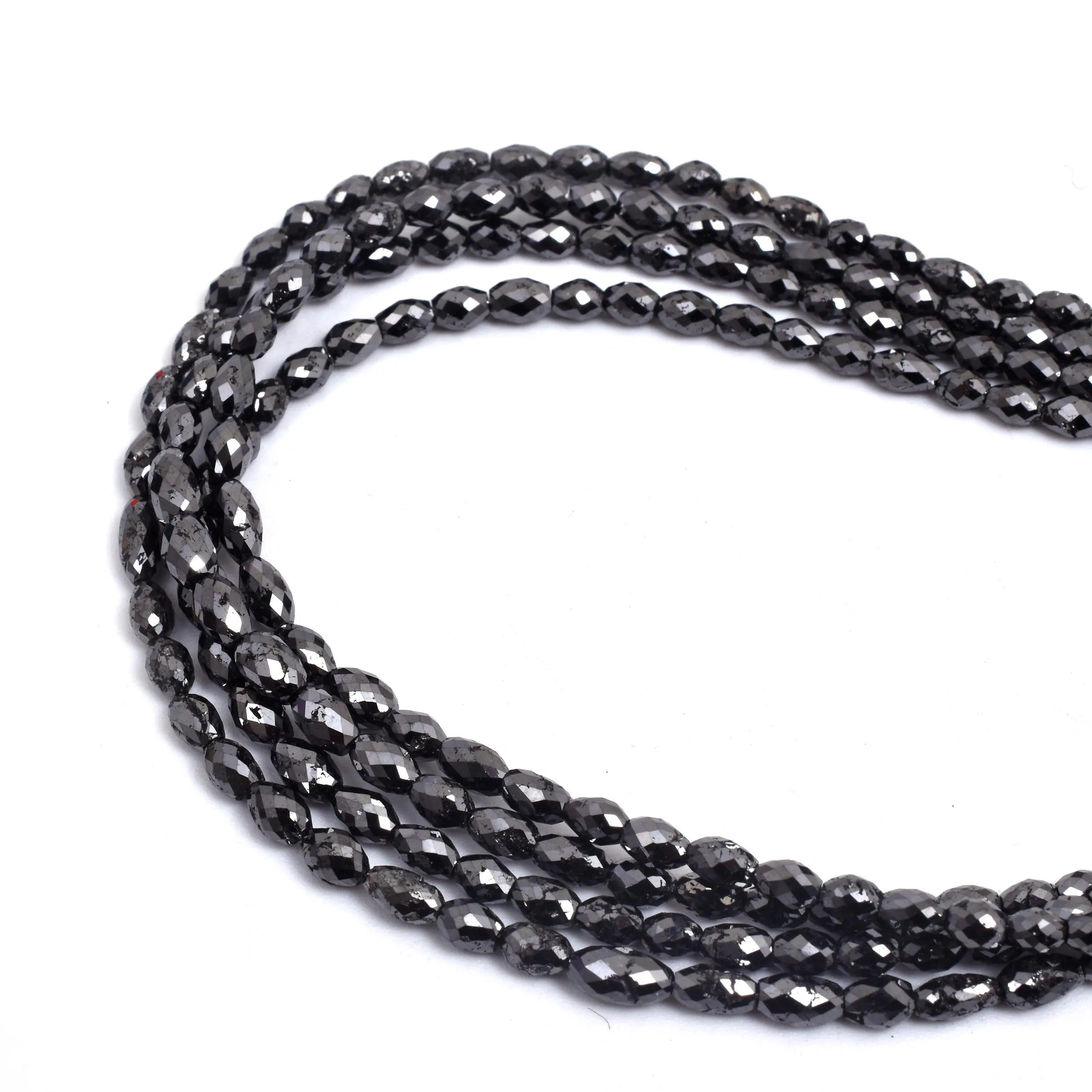 Black beaded necklace on a white background