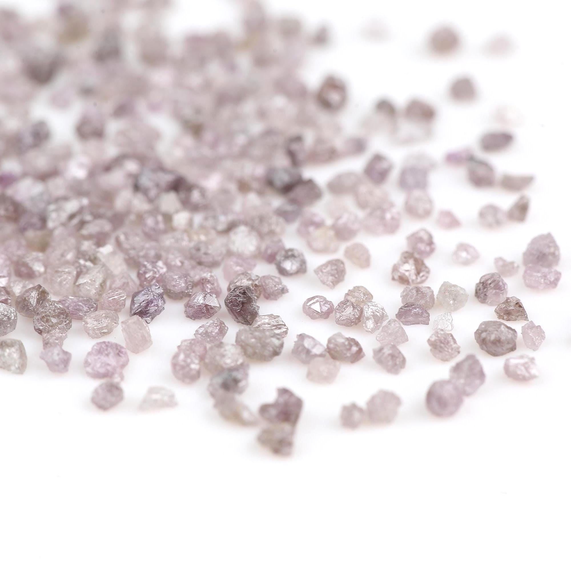 Close-up of raw diamonds on a white background